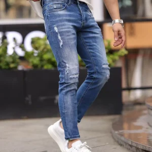 Jean slim bleu denim à déchirures fines